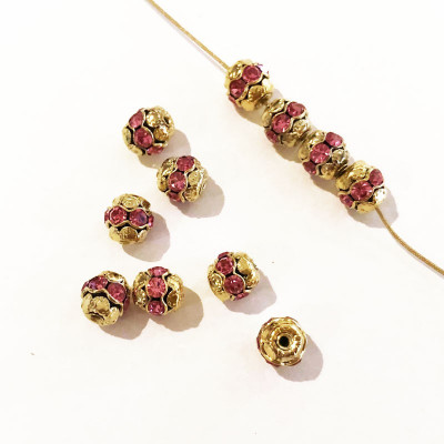 10 perles alliage et strass. 8 mm. Doré / rose