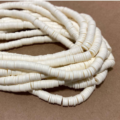 6 mm. Heishi polymère ivoire.Le fil 40 cm.